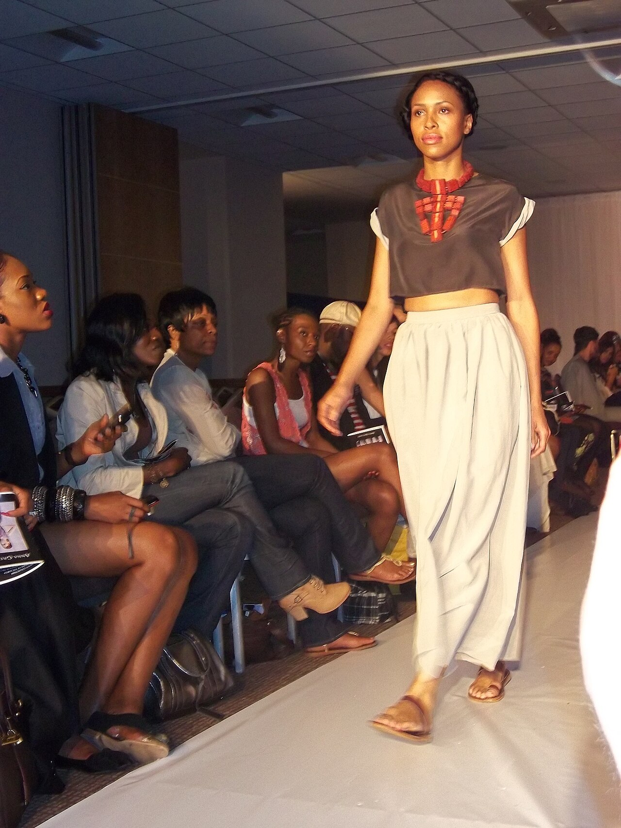 Model on the runway in front of the front row, London Fashion Week