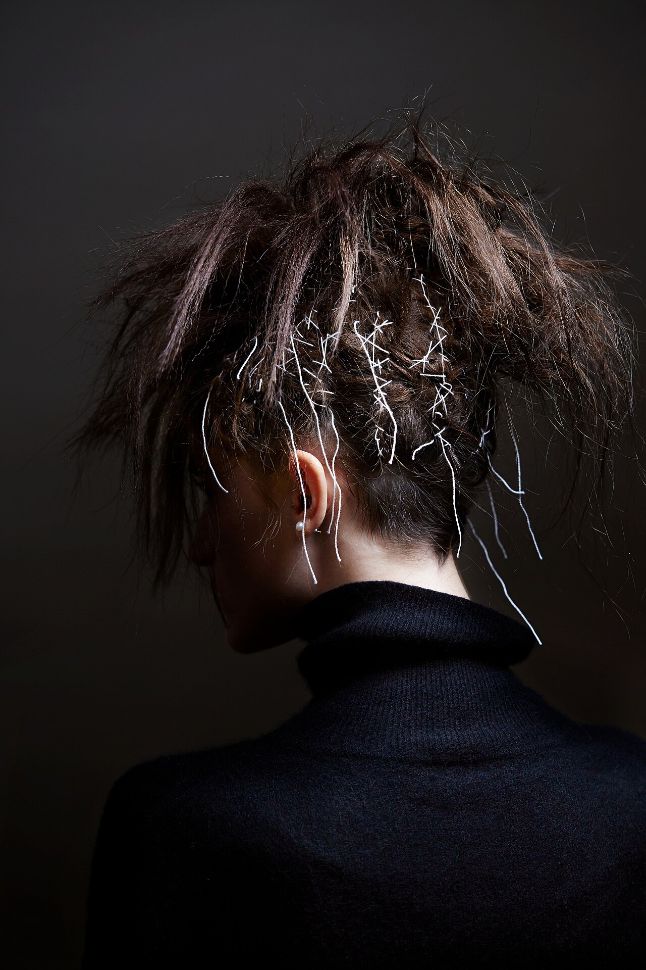 Sculptural hair detail backstage, Paris Fashion Week