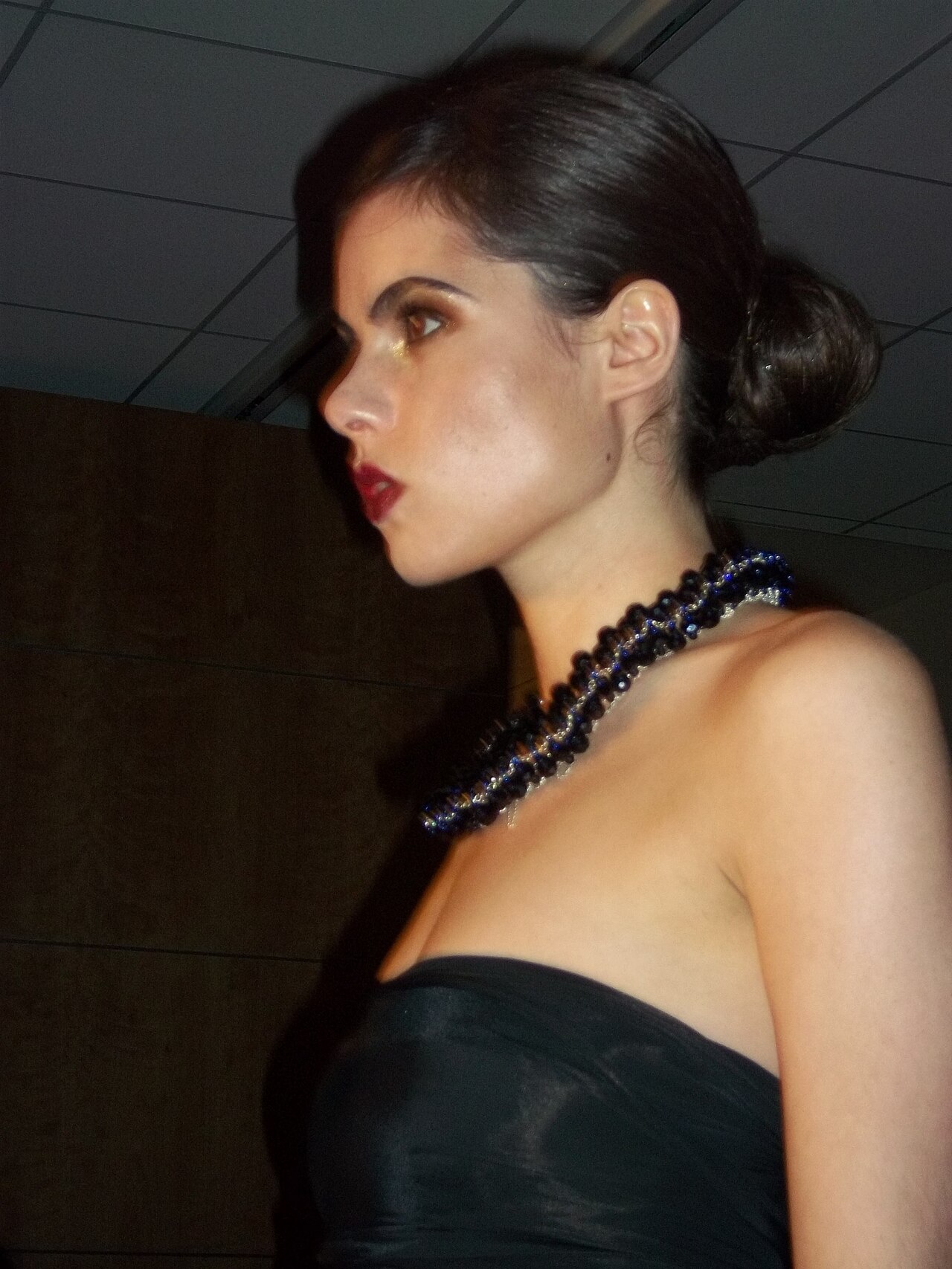 Profile portrait in a black evening dress, London Fashion Week